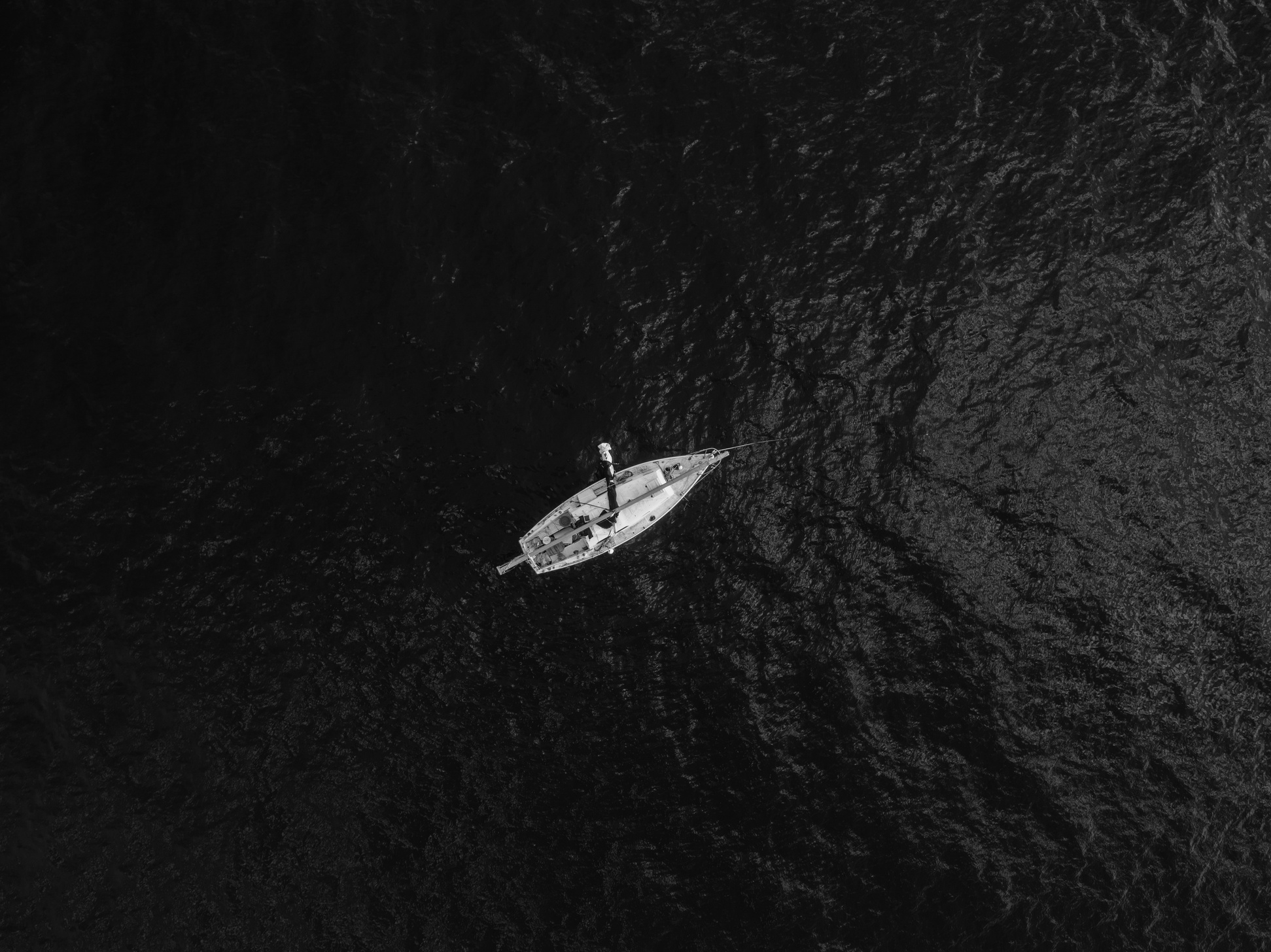Aerial Photography Of Boat In The Middle Of Body Of Water
